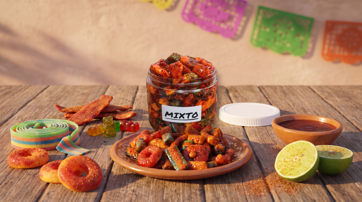 Chilitos Mixto Mexican candy variety tub opened with chamoy gummy bears, peach rings, sour belts and chamoy dried mango spilled around it